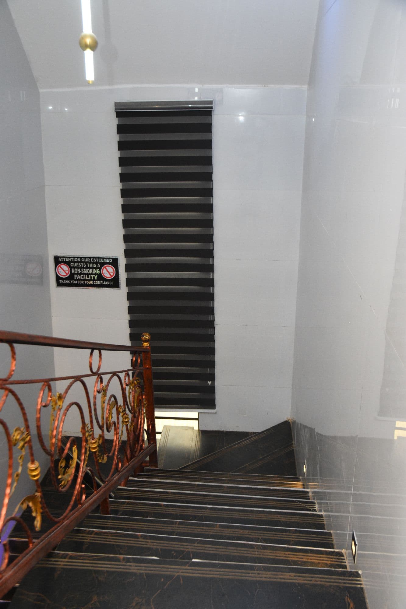 Staircase with wrought-iron railing
